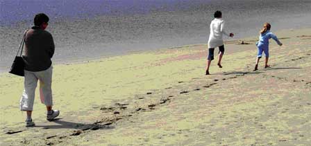 Image of people walking along a beach